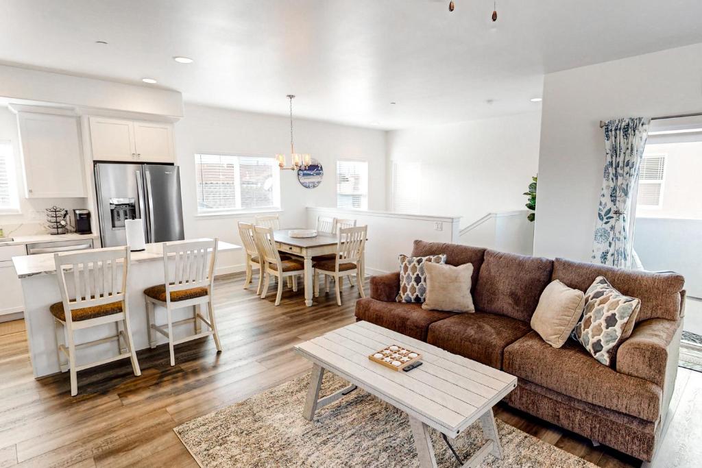 a living room and kitchen with a couch and a table at The Luxe Overlook in Oceano