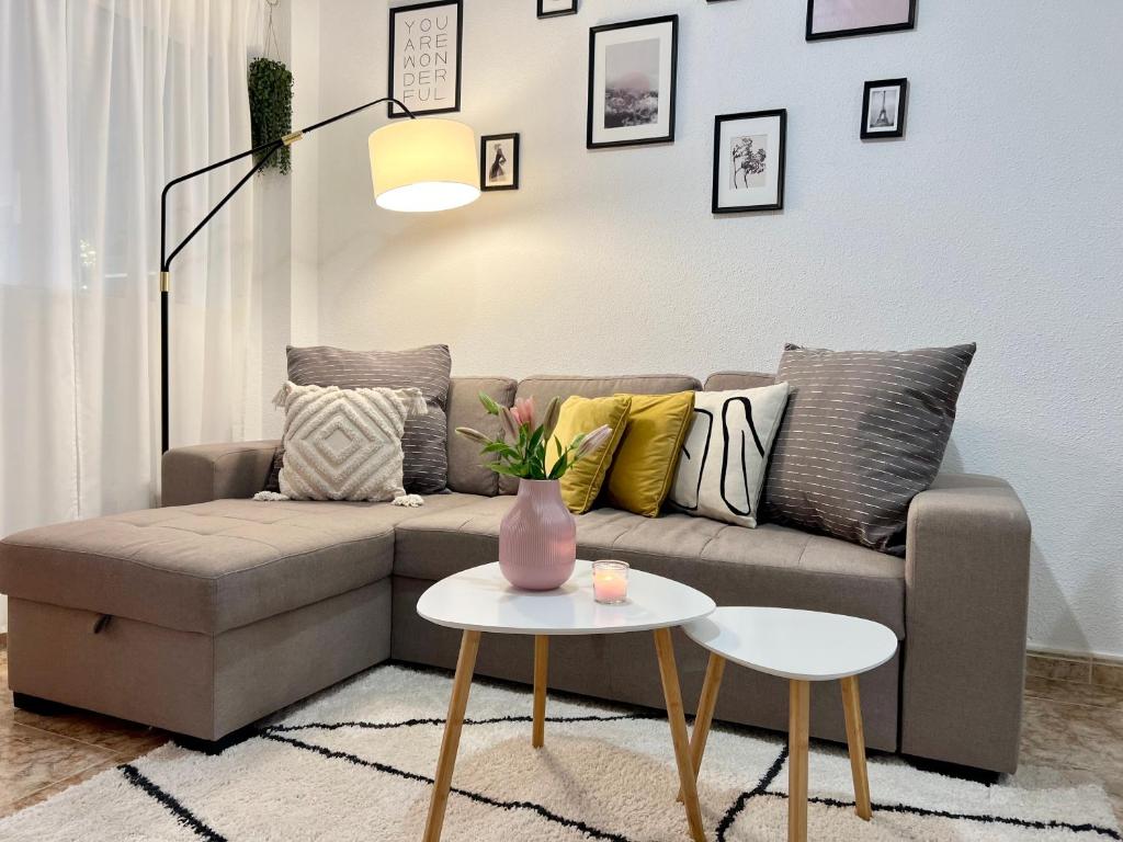 a living room with a couch and a table at Lovely Apartament with a sunny terrace in Torrevieja