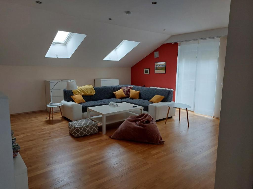 a living room with a couch and a table at Ferienwohnung Gerti in Pinkafeld