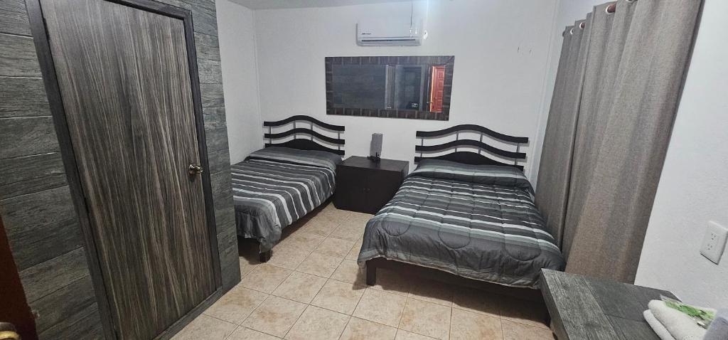 Postel nebo postele na pokoji v ubytování Hotel posada MARCAS