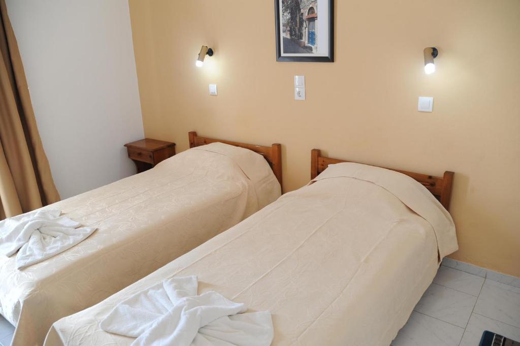 Postel nebo postele na pokoji v ubytování Irene Studios