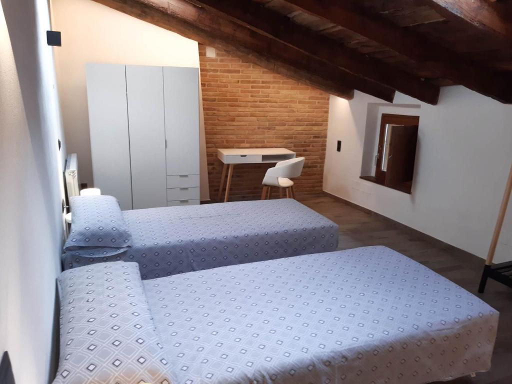 Postel nebo postele na pokoji v ubytování Niu de Queralt