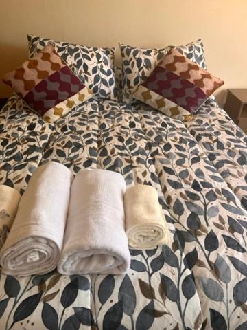 Postel nebo postele na pokoji v ubytování Hostal Damatierra
