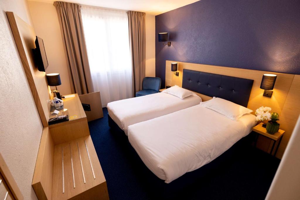 Postel nebo postele na pokoji v ubytování Best Western Hôtel Le Sud