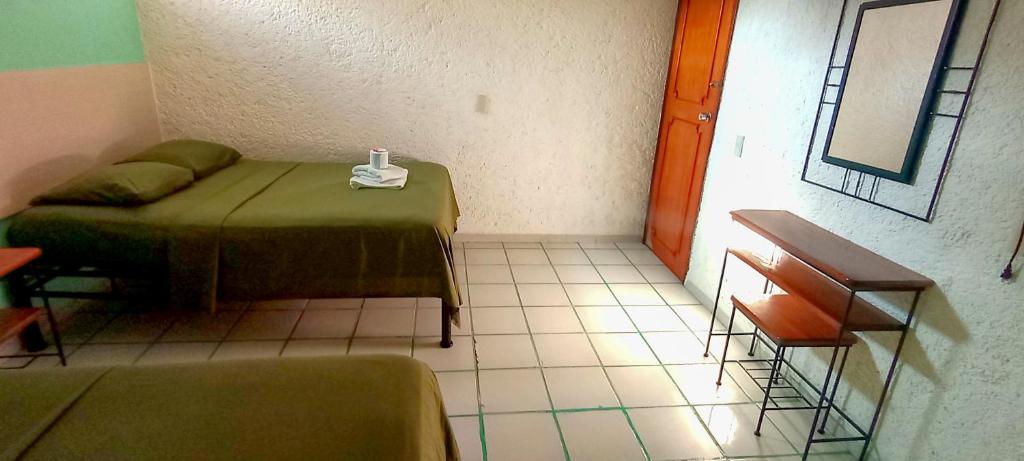 Postel nebo postele na pokoji v ubytování Posada Nacha`n - Ka`an