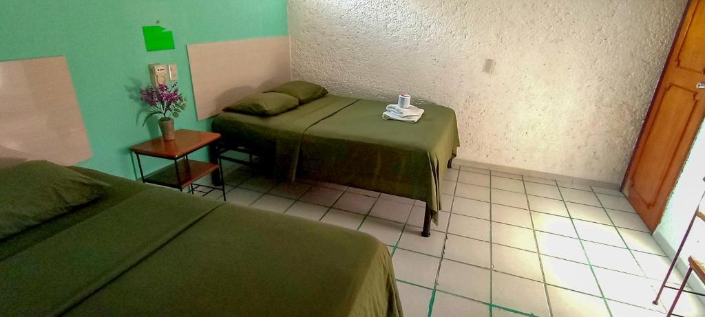 Postel nebo postele na pokoji v ubytování Posada Nacha`n - Ka`an