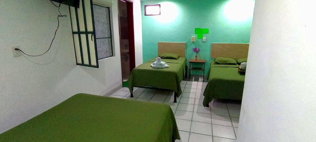 Postel nebo postele na pokoji v ubytování Posada Nacha`n - Ka`an