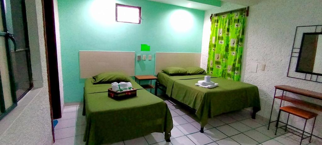 Postel nebo postele na pokoji v ubytování Posada Nacha`n - Ka`an