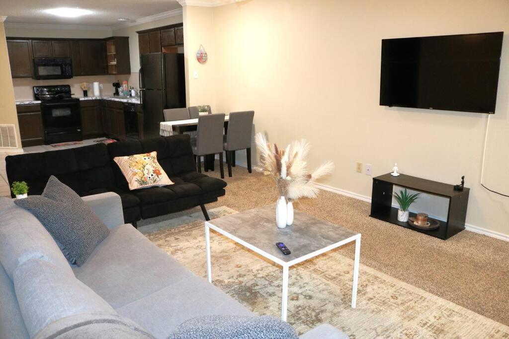 a living room with a couch and a table at Lubbock haven 3Beds, 3 baths in Lubbock