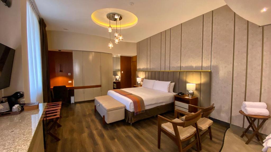 Ένα ή περισσότερα κρεβάτια σε δωμάτιο στο ARIQUEPAY HOTEL