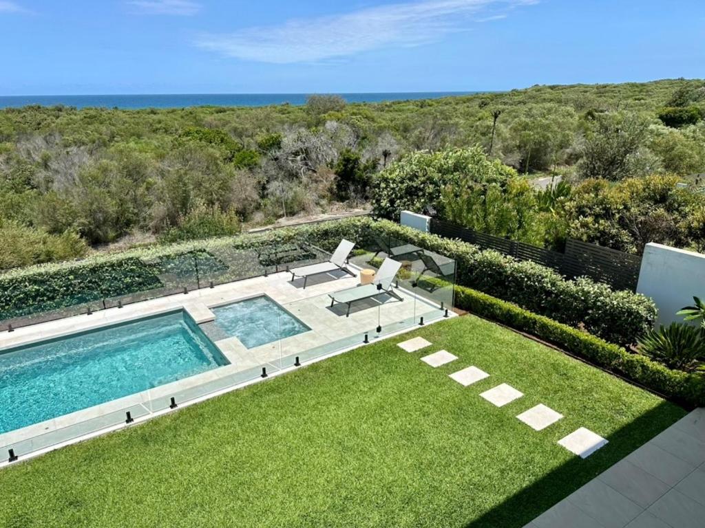 an overhead view of a swimming pool in a yard at Beachfront Haven at Magenta in Magenta