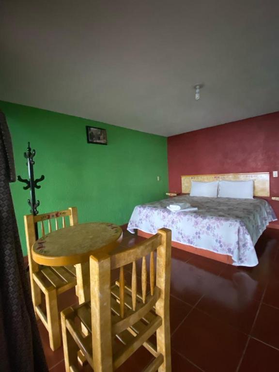 Postel nebo postele na pokoji v ubytování Cabañas y Habitaciones El Malecón