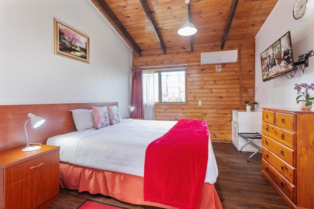Postel nebo postele na pokoji v ubytování Grange Motel