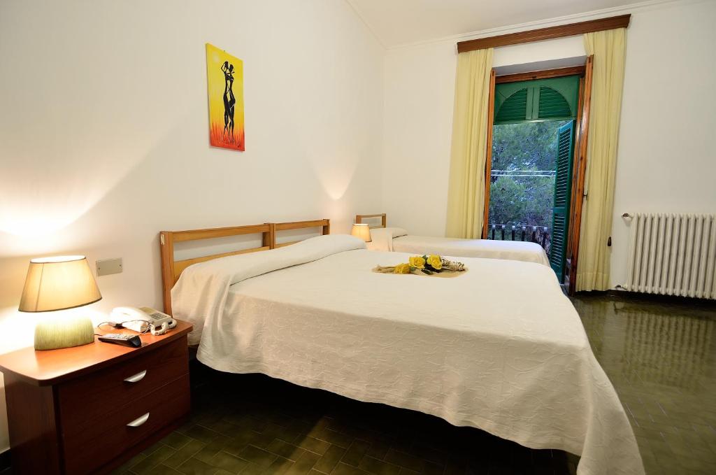 Postel nebo postele na pokoji v ubytování Hotel La Silvana