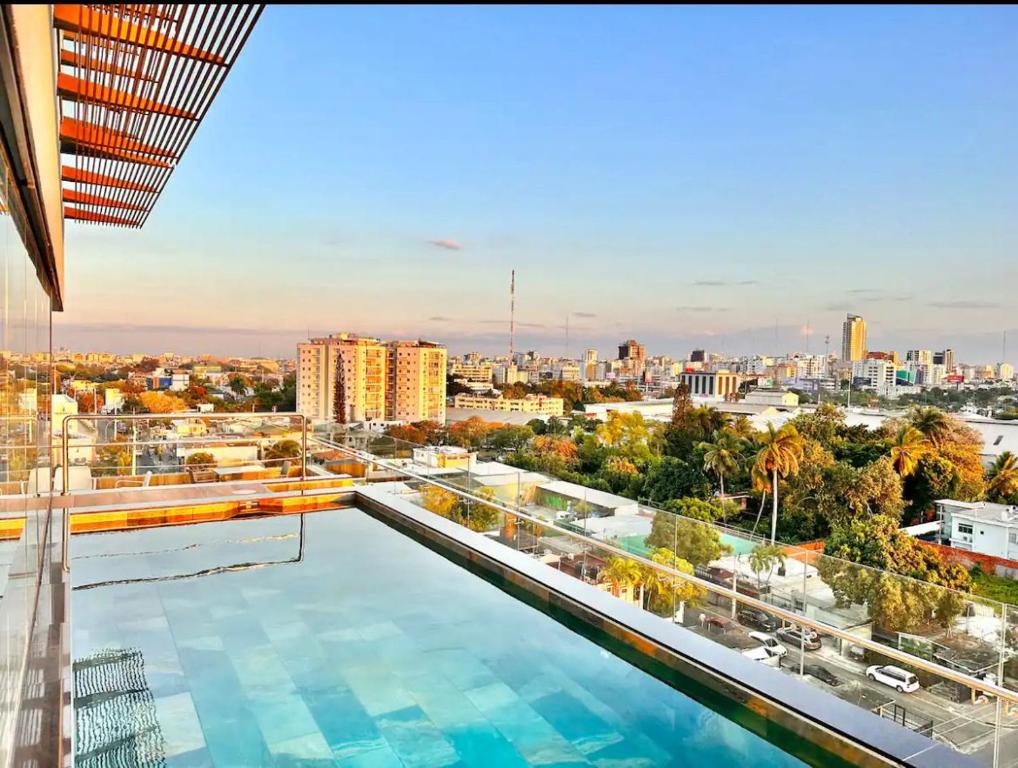 a large swimming pool on top of a building at Luxury Apartment Centrally in Santo Domingo