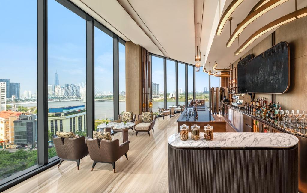 a hotel lobby with a view of a city at Hilton Saigon in Ho Chi Minh City