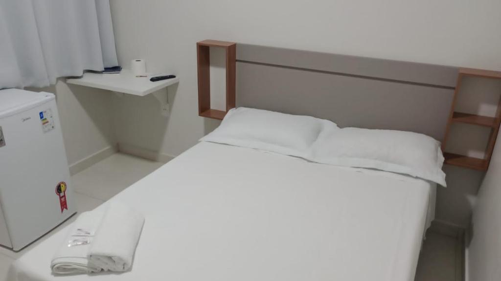 Ένα ή περισσότερα κρεβάτια σε δωμάτιο στο Hotel Califórnia