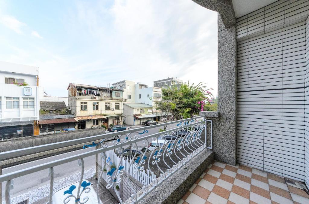 a balcony with a view of a city at 晶藍色美人魚 Mermaid Inn in Hualien City