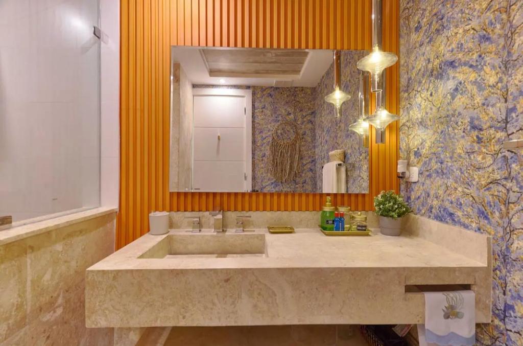 a bathroom with a large sink and a mirror at Juan Dolió Service Vip in Santo Domingo
