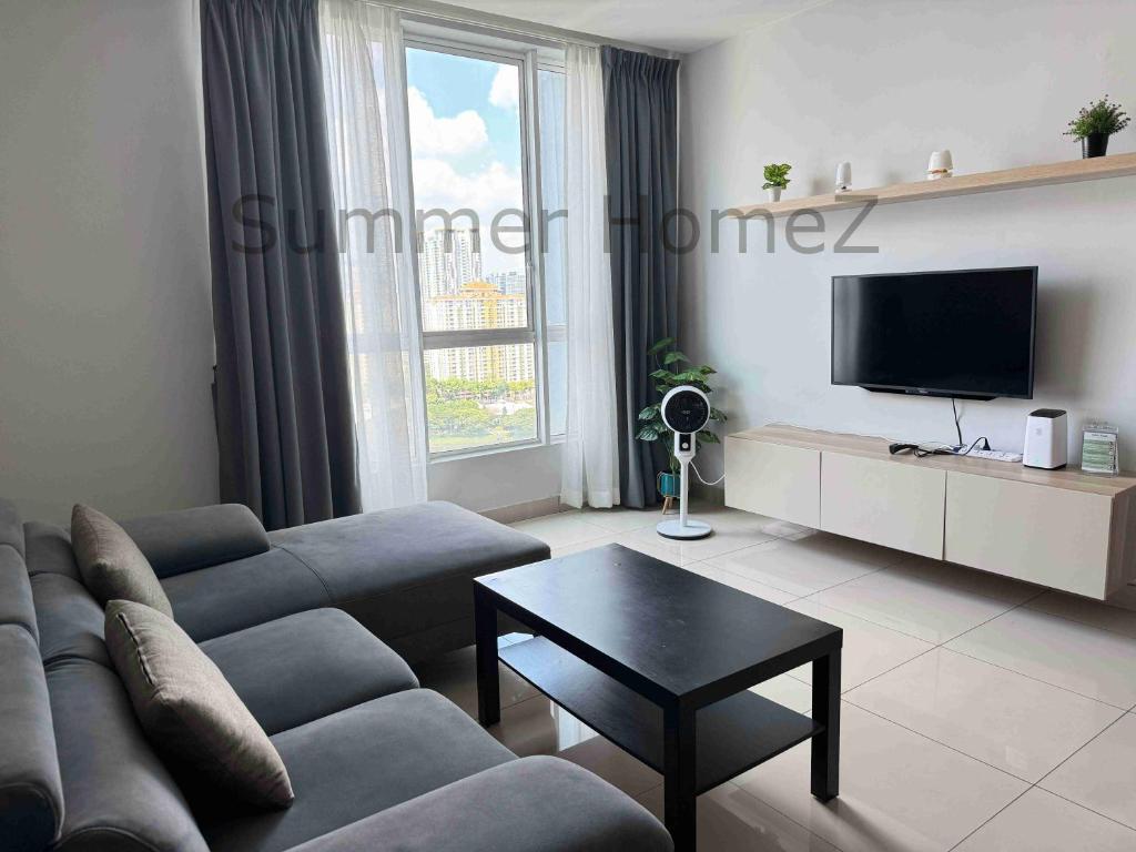 a living room with a couch and a tv at 3BR 5-6Pax Zetapark Setapak Central Near Zoo in Kuala Lumpur