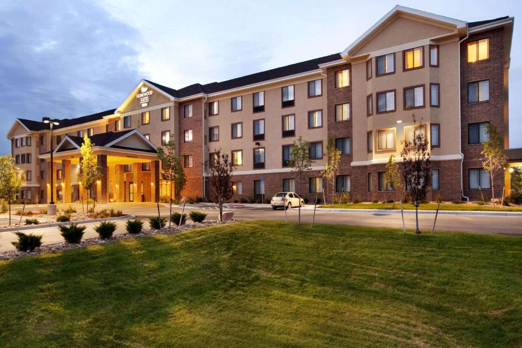 a large building with a lawn in front of it at Homewood Suites by Hilton Denver - Littleton in Littleton