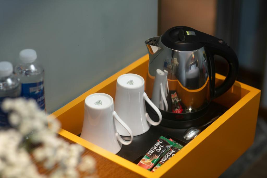 Příslušenství pro přípravu čaje a kávy v ubytování GRAND CITITEL Hanoi Hotel & Spa