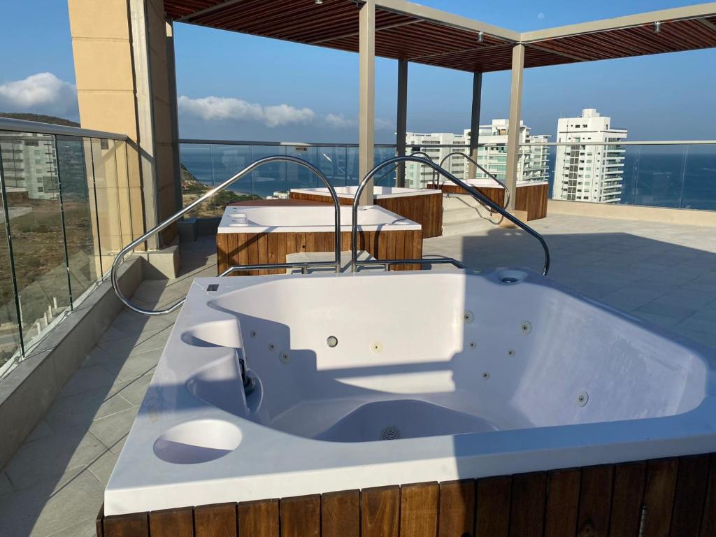 a bath tub on the balcony of a building at El Samario Cumbia Host-Playa Salguero- Santa Marta in Gaira