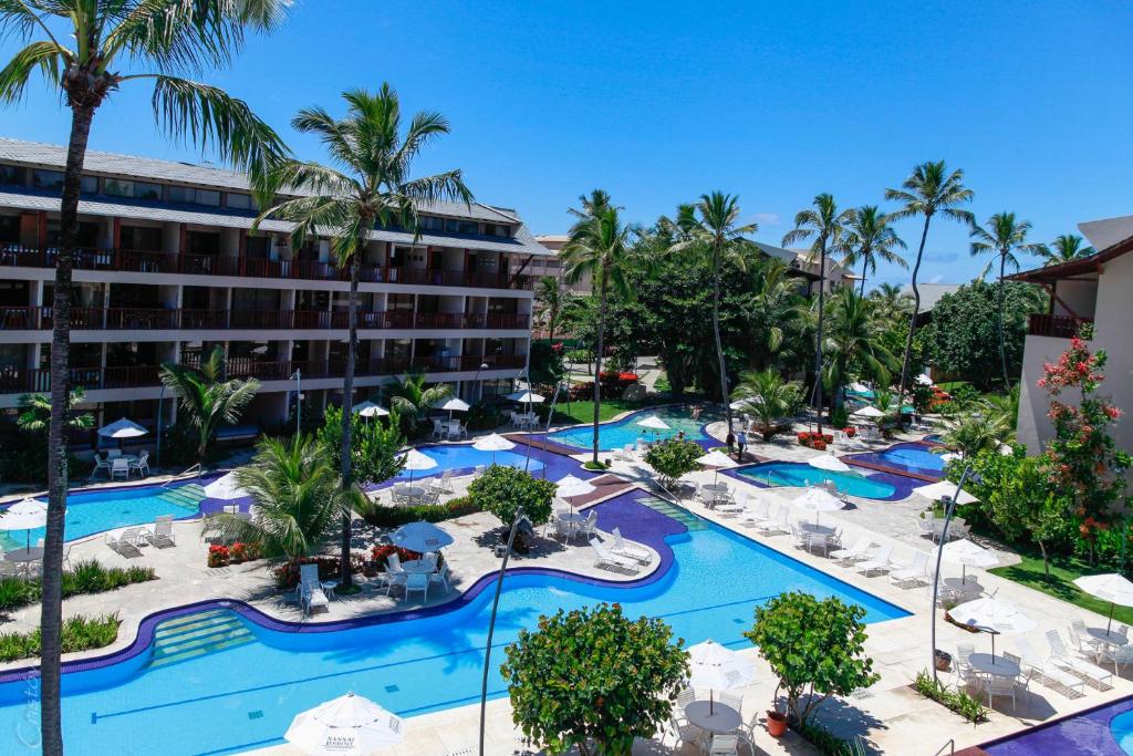 an aerial view of a resort with a pool at Flat no Nannai Residence Muro Alto in Porto De Galinhas