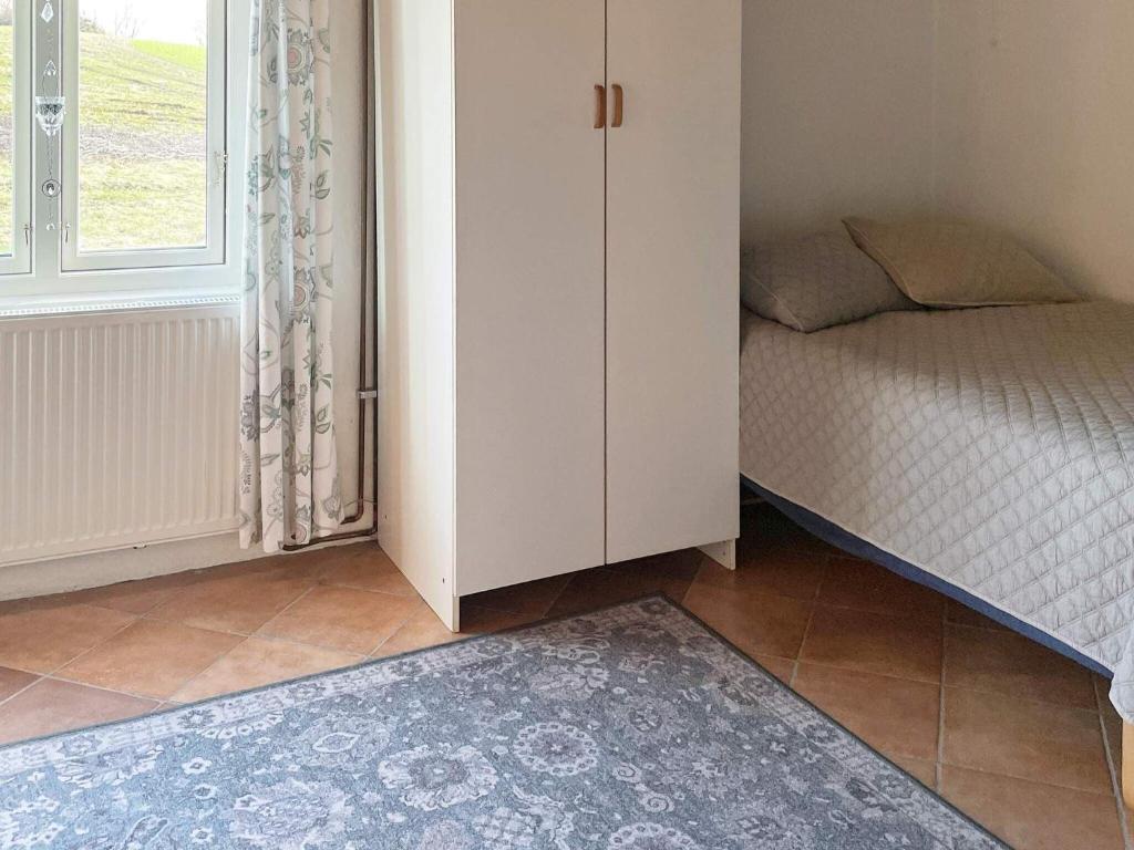 Postel nebo postele na pokoji v ubytování Holiday home Vollsjö