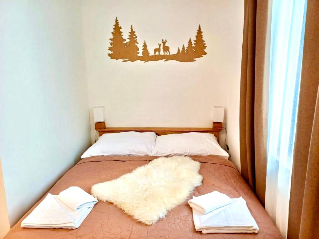 Postel nebo postele na pokoji v ubytování Paseky Apartments Resort
