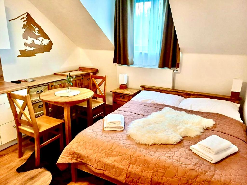 Postel nebo postele na pokoji v ubytování Paseky Apartments Resort