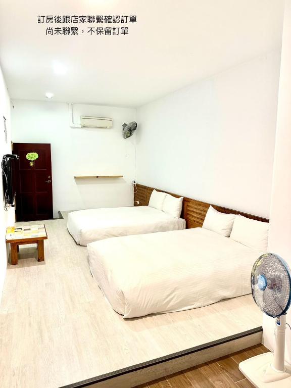 Postel nebo postele na pokoji v ubytování Nanwan254 Homestay