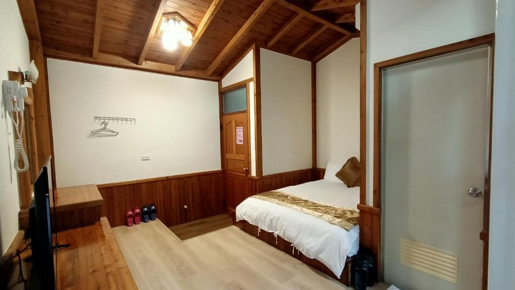 Postel nebo postele na pokoji v ubytování Xitou Tianpin Homestay