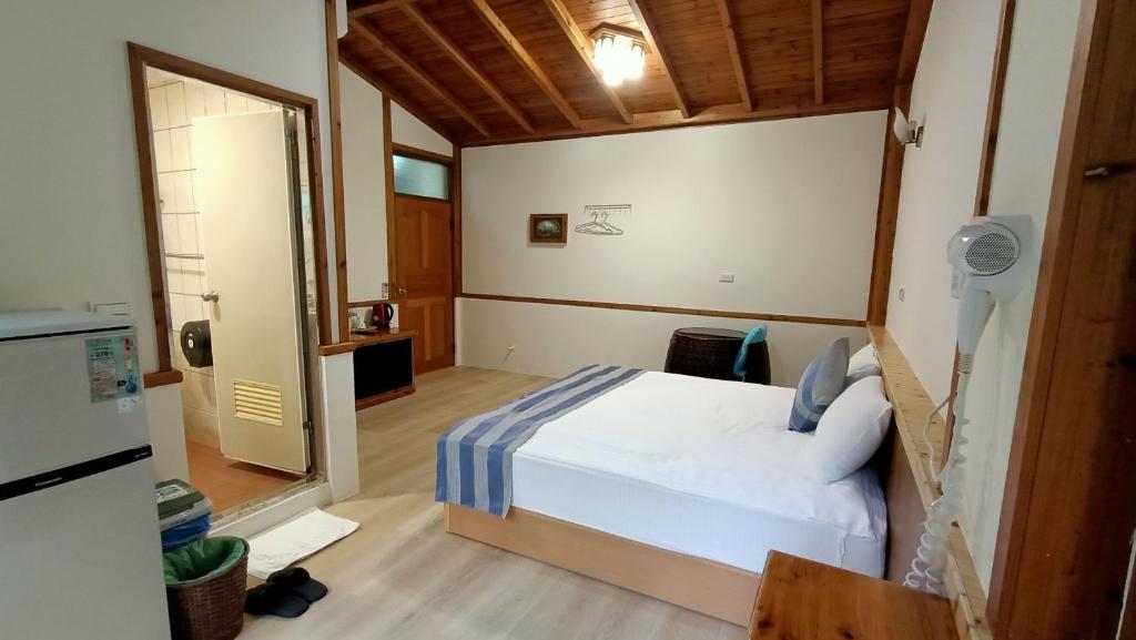 Postel nebo postele na pokoji v ubytování Xitou Tianpin Homestay