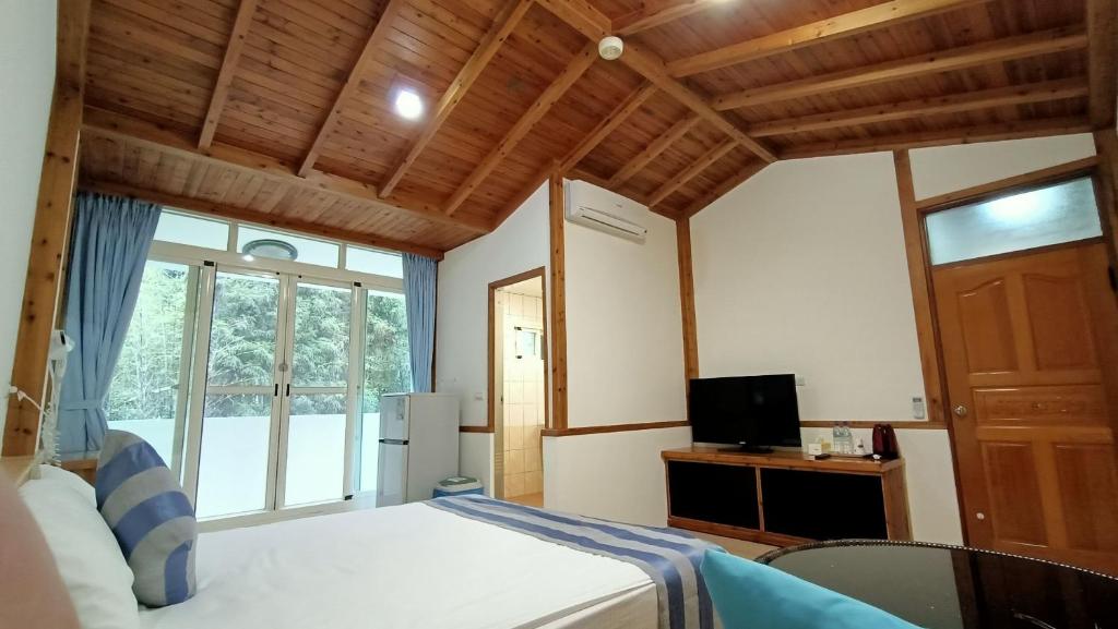 TV a/nebo společenská místnost v ubytování Xitou Tianpin Homestay