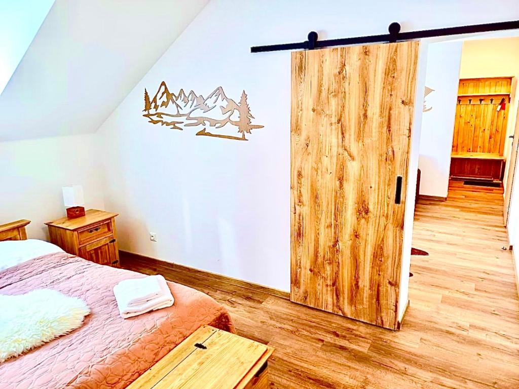 Postel nebo postele na pokoji v ubytování Paseky Apartments Resort