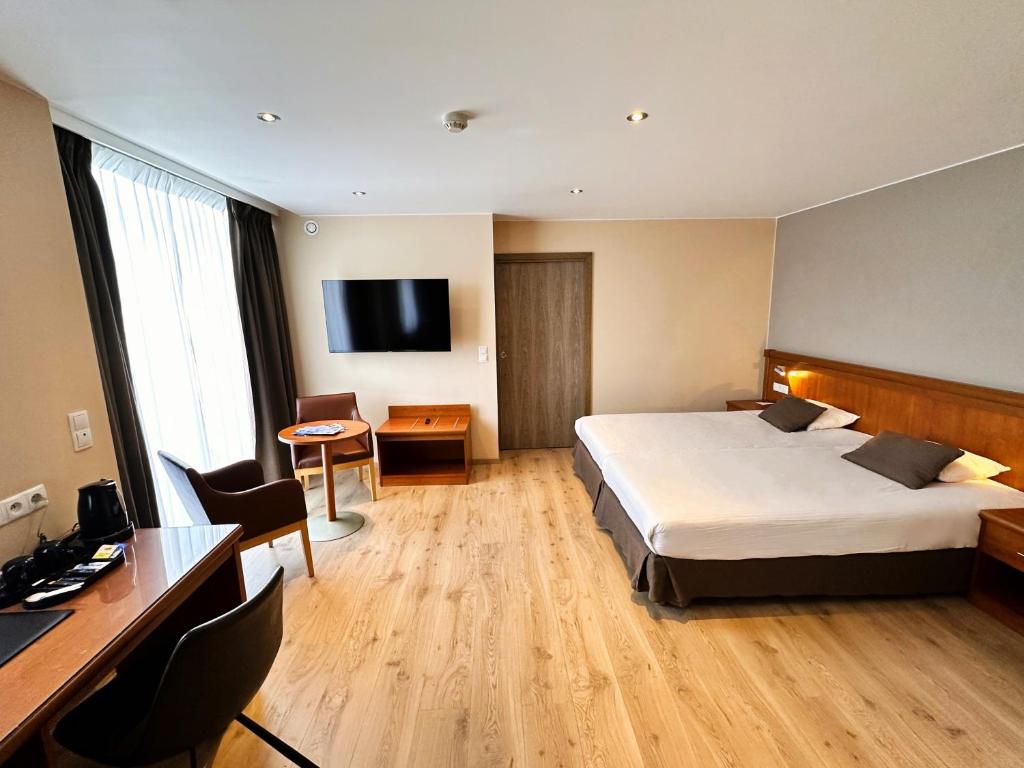 TV a/nebo společenská místnost v ubytování Hotel Melba