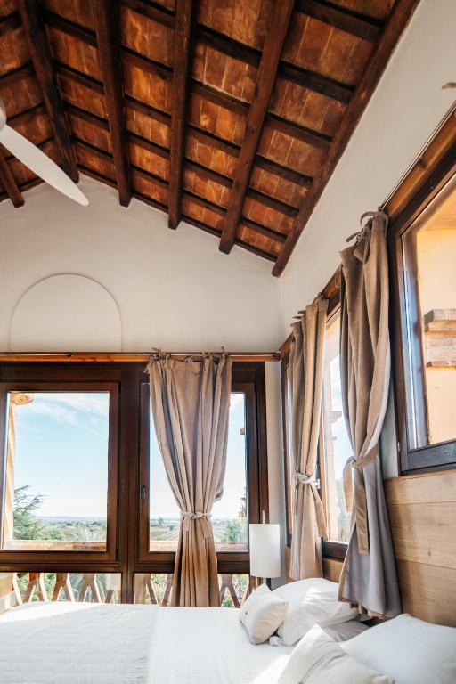 Postel nebo postele na pokoji v ubytování Hotel Boutique Mas Passamaner