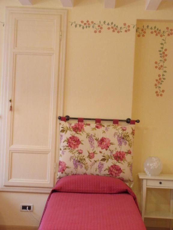 Łóżko lub łóżka w pokoju w obiekcie Mimì Apartment