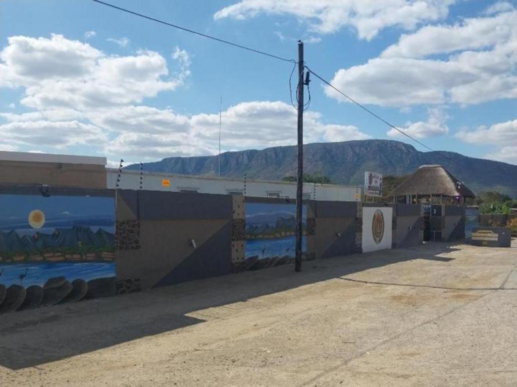 a building with a mural on the side of it at MKHUZE INN in Mkuze