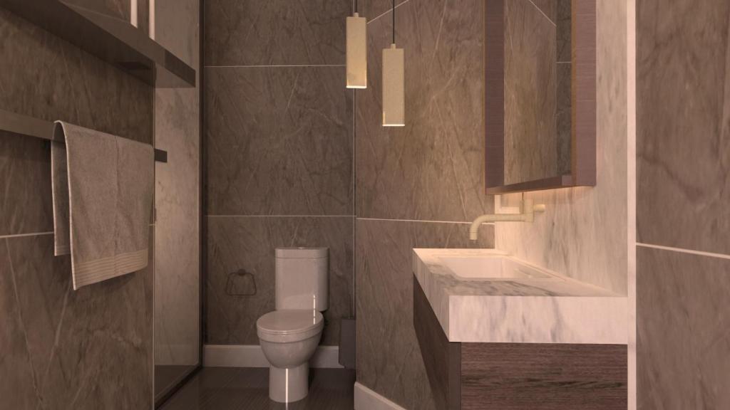 a bathroom with a toilet and a sink at Bridge Steet Apartments in Morpeth