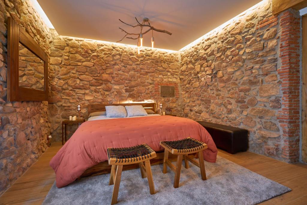 Postel nebo postele na pokoji v ubytování Masia de Can Ferrer