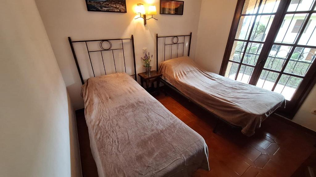 Postel nebo postele na pokoji v ubytování Torre vella 165