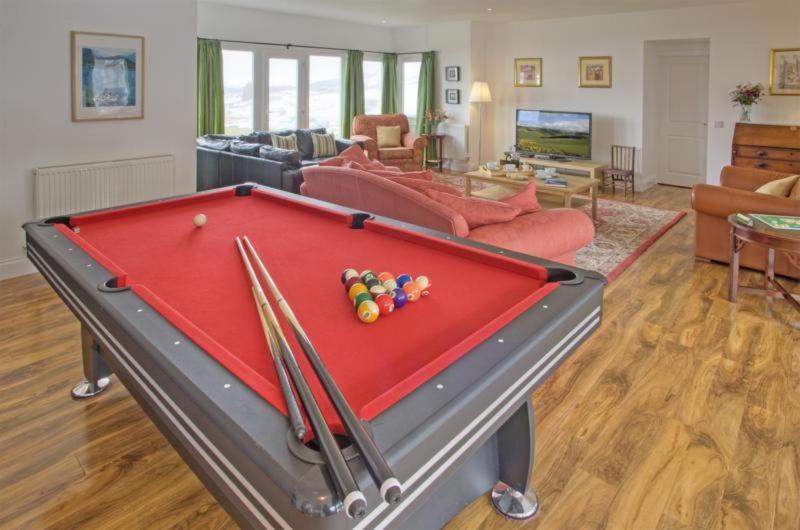 a living room with a pool table with cue balls at Ettrick View in Selkirk
