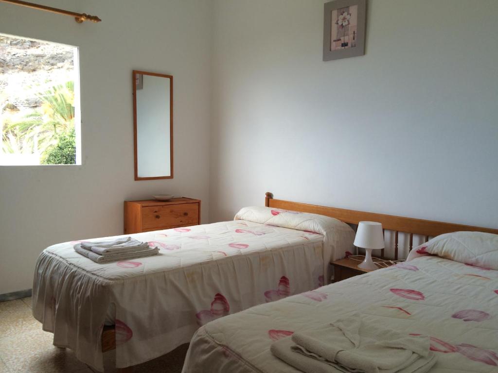 Postel nebo postele na pokoji v ubytování Apartamentos Domínguez