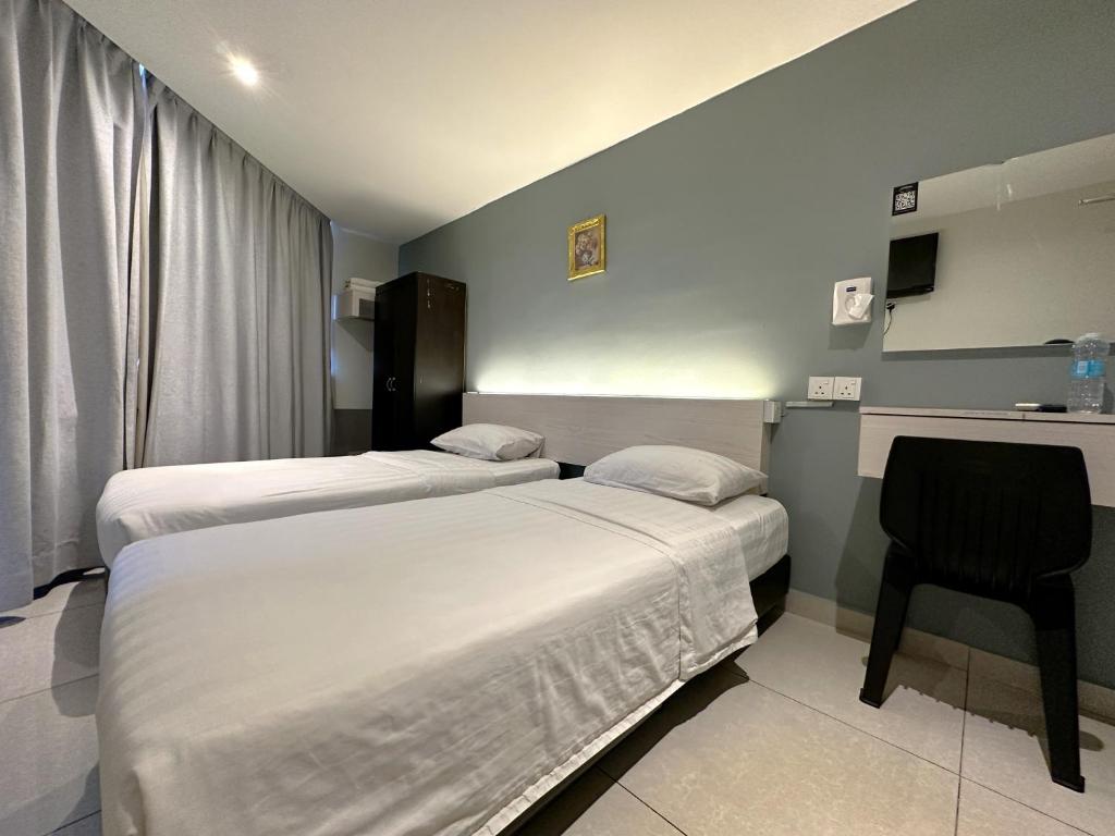 Postel nebo postele na pokoji v ubytování De UPTOWN Hotel @ P.J. 222