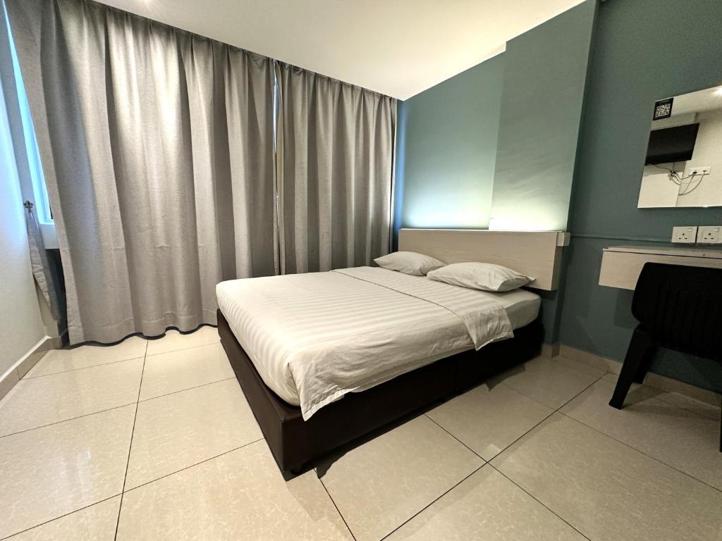 Postel nebo postele na pokoji v ubytování De UPTOWN Hotel @ P.J. 222