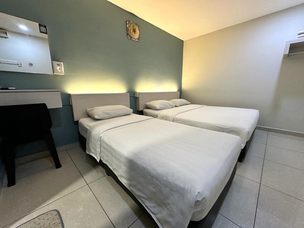 Postel nebo postele na pokoji v ubytování De UPTOWN Hotel @ P.J. 222