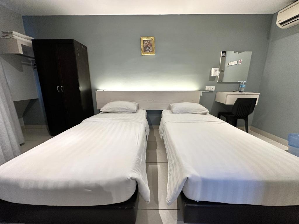 Postel nebo postele na pokoji v ubytování De UPTOWN Hotel @ P.J. 222