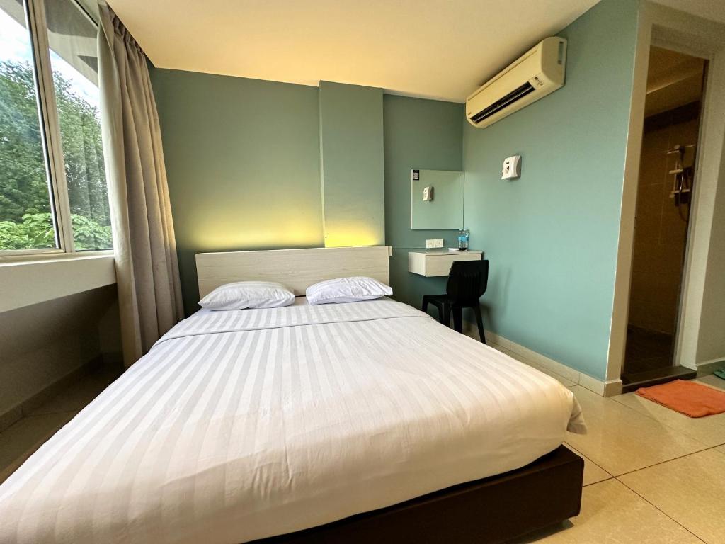 Postel nebo postele na pokoji v ubytování De UPTOWN Hotel @ P.J. 222
